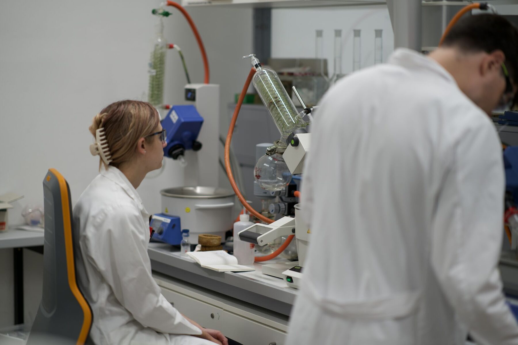 Rotary evaporator station, two chemists