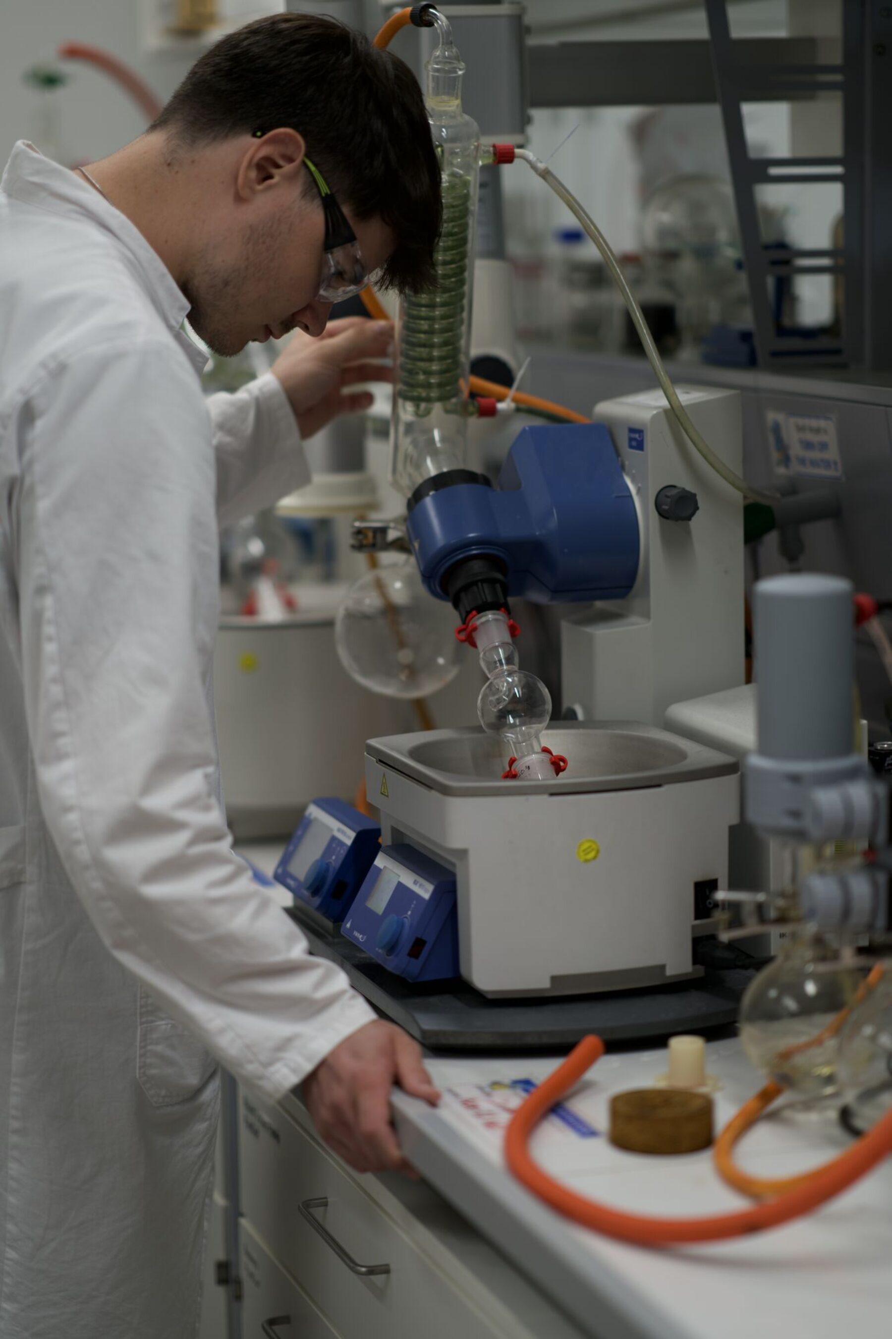 Chemist adjusting the rotary evaporator