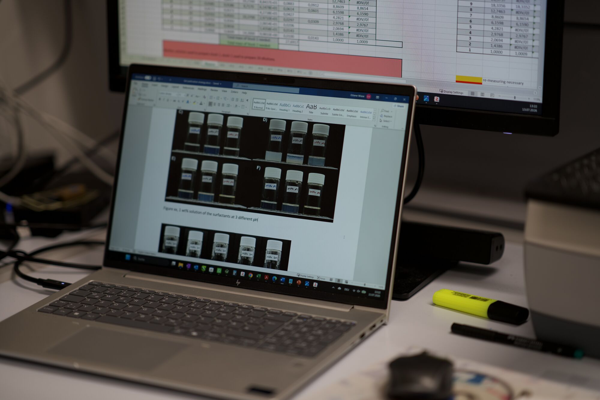 Laptop displaying rheometer analysis software next to a data monitor