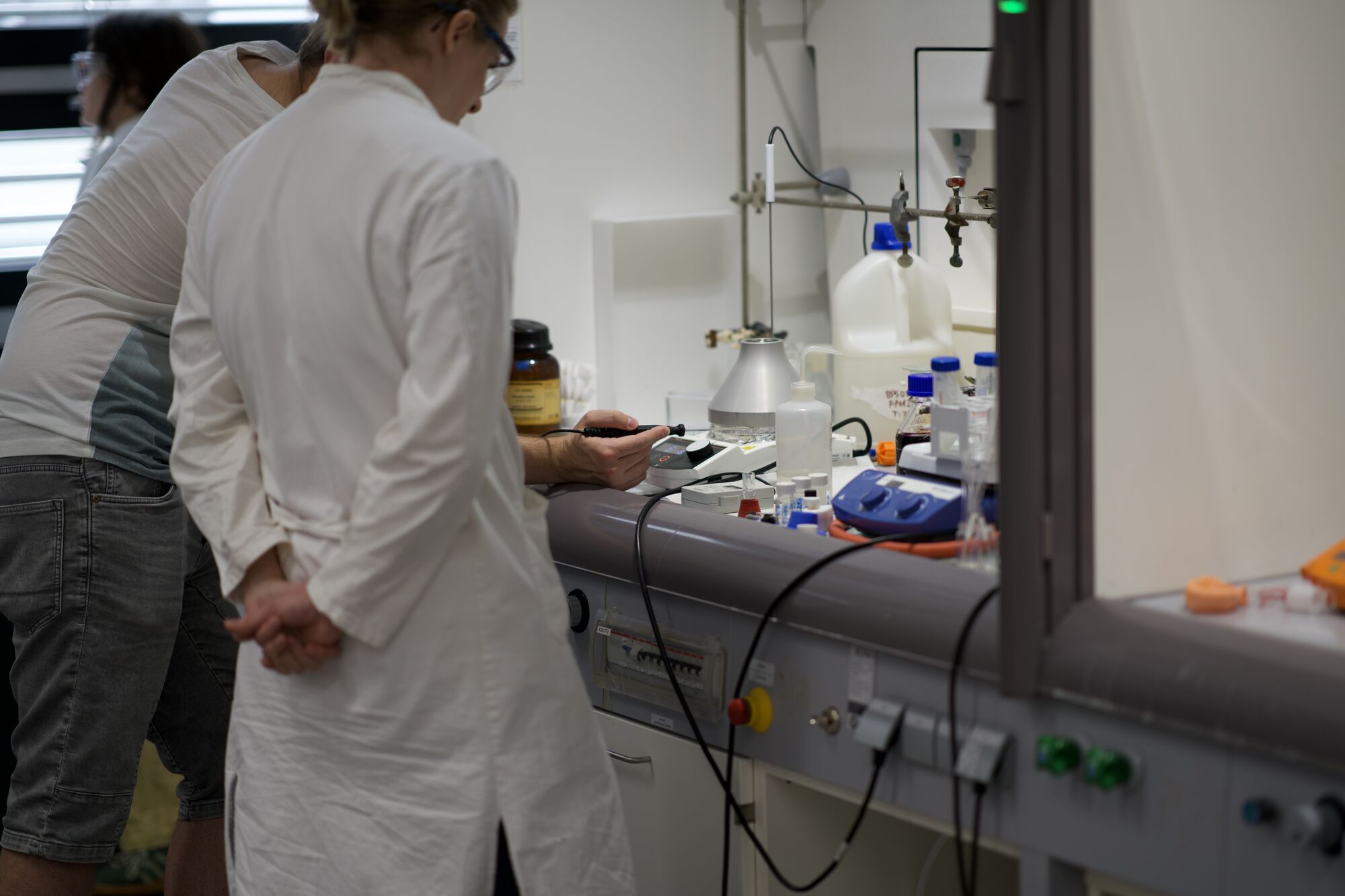 Two chemists at the lab bench