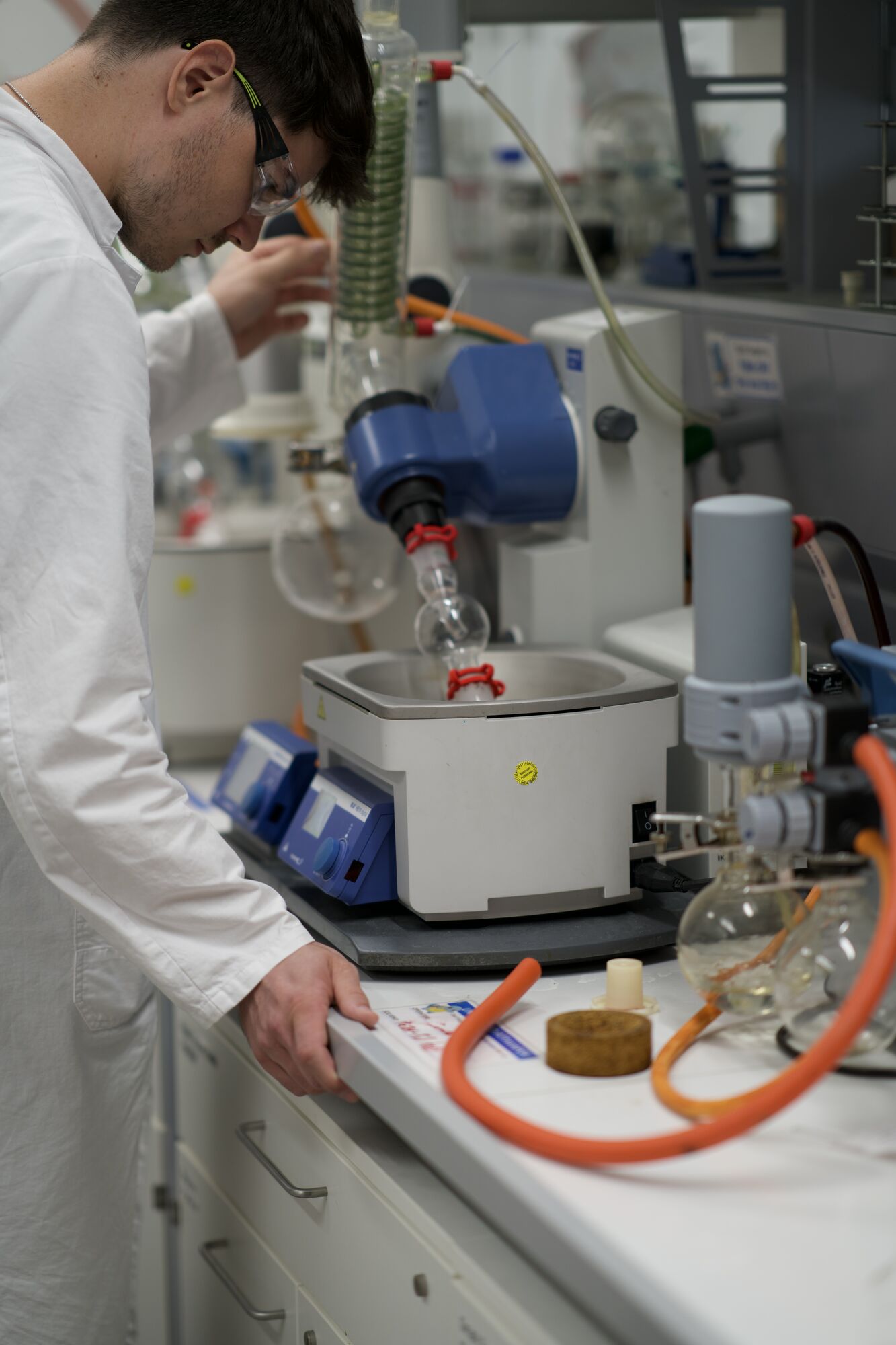 Chemist operating a rotary evaporator