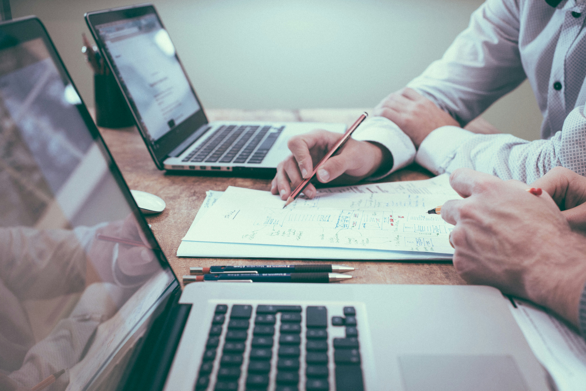 Commercial team reviewing documents in a business meeting