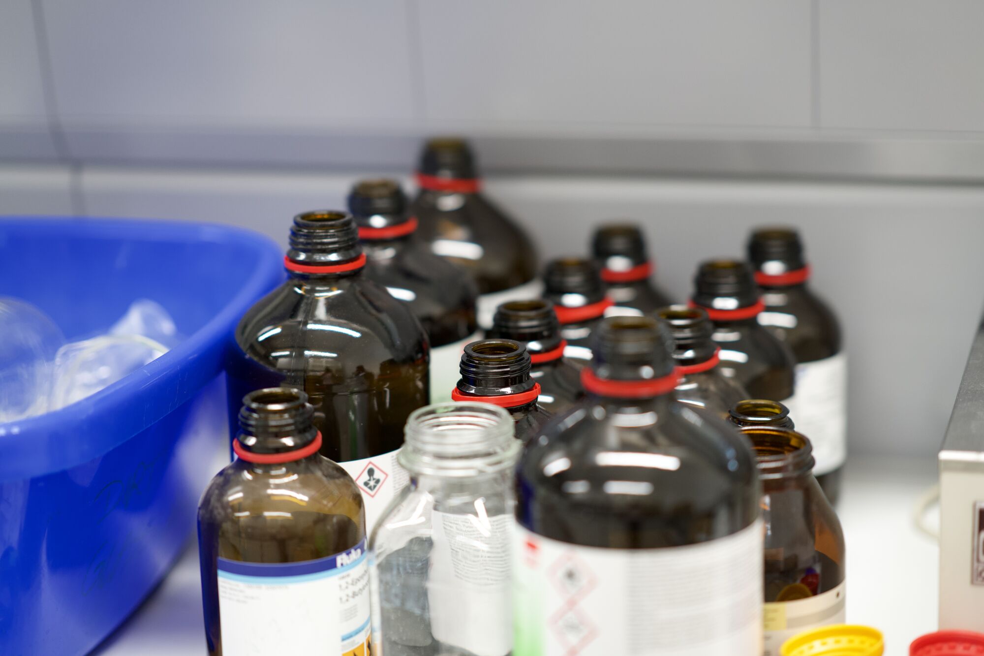 Rows of reagent bottles on a lab bench